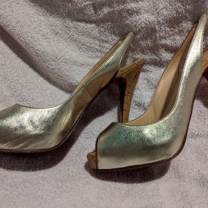 Gold Louboutin "Private Number" heels